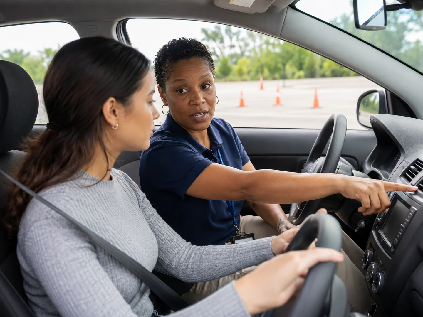 Driving school instructor preparing a safe lesson with a student