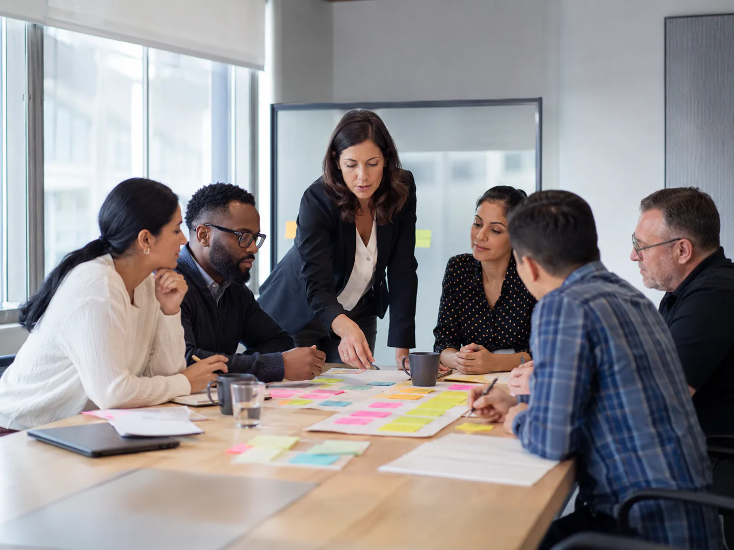 Corporate trainer leading a practical workshop for a diverse business team