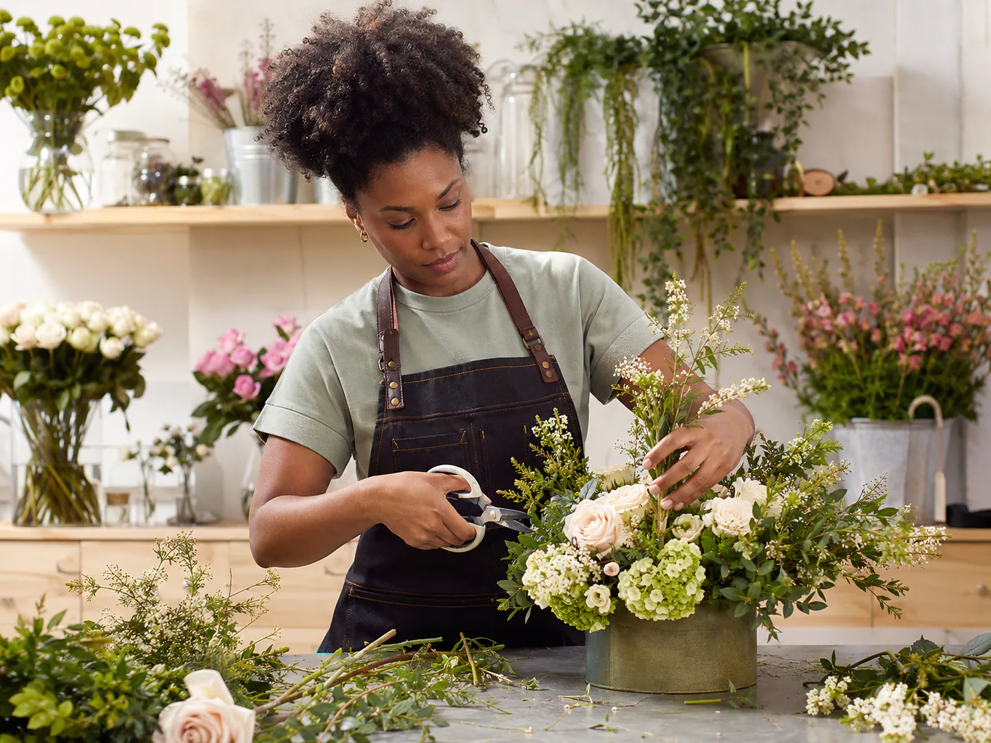 Florist creating an arrangement for a real event
