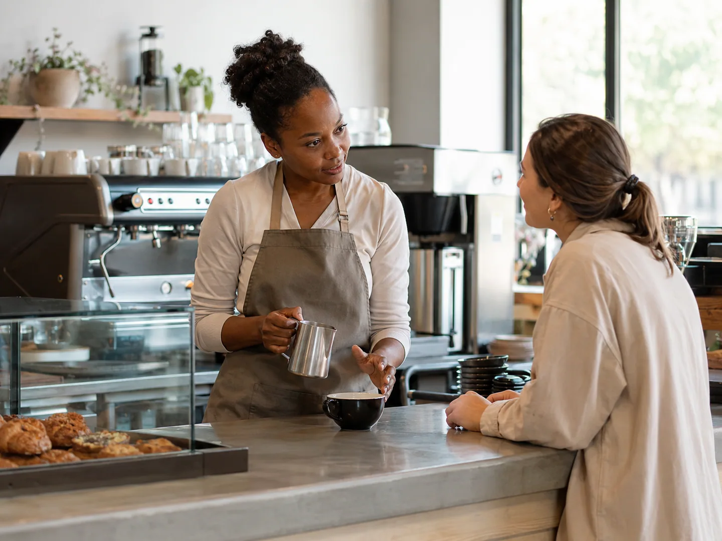 Cafe staff creating a welcoming local guest experience